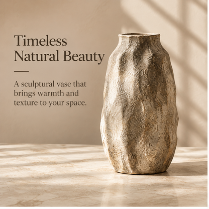 Full view of the taupe sculptural vase showing its curved silhouette and narrow opening.